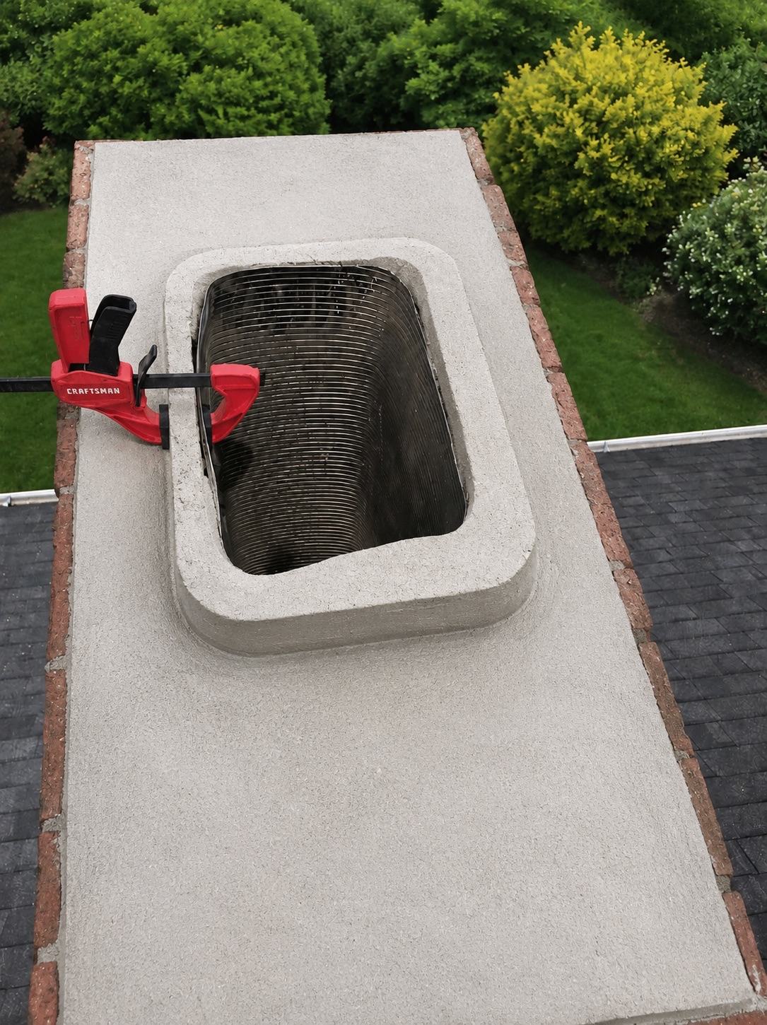 Stainless steel chimney liner repair on a residential chimney