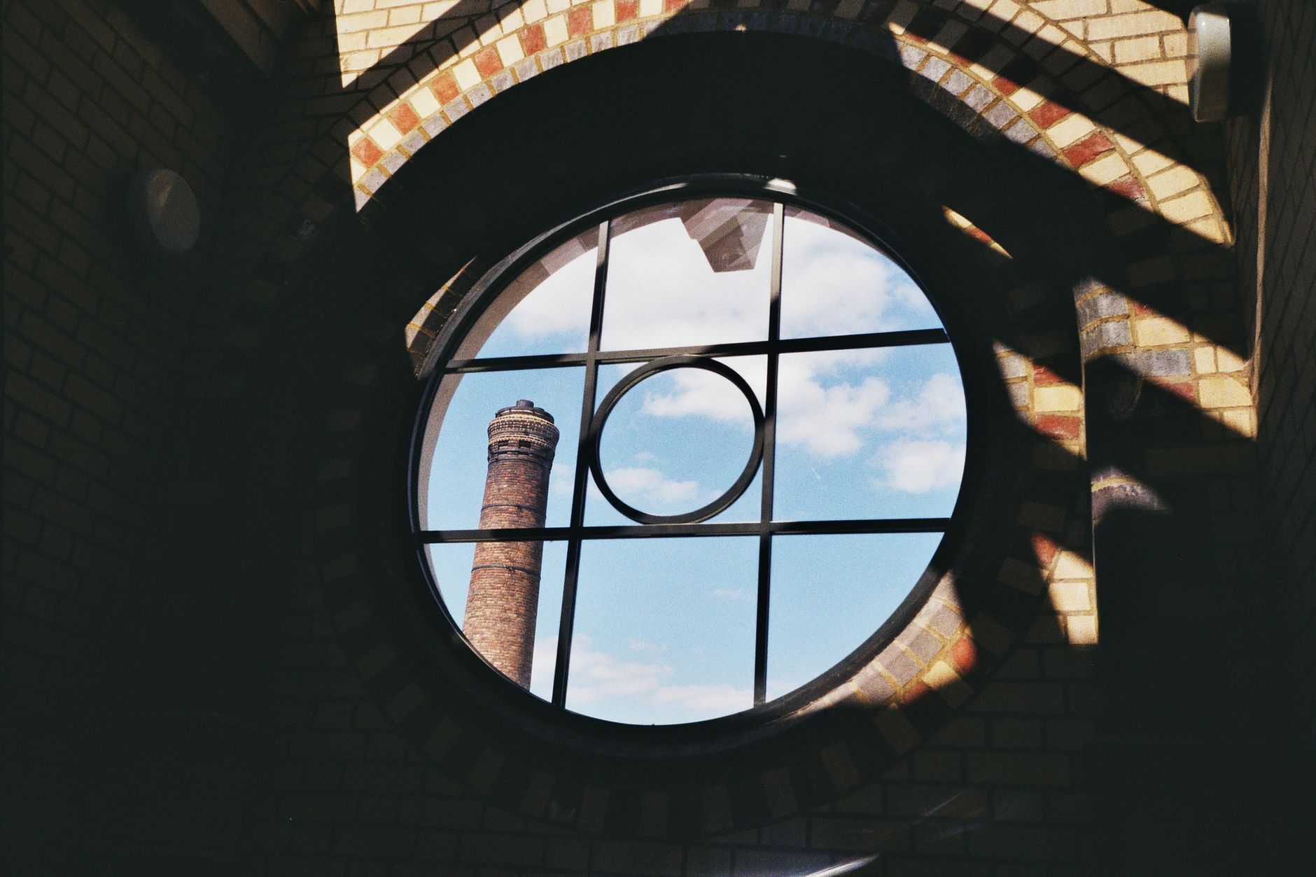 Looking up from inside a brick chimney showing the flue liner — chimney liner guide for homeowners